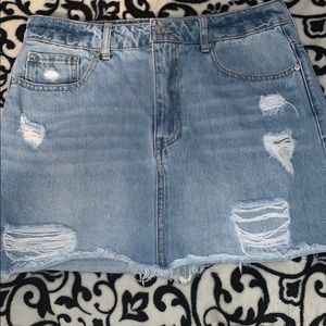 Ripped light blue jean skirt